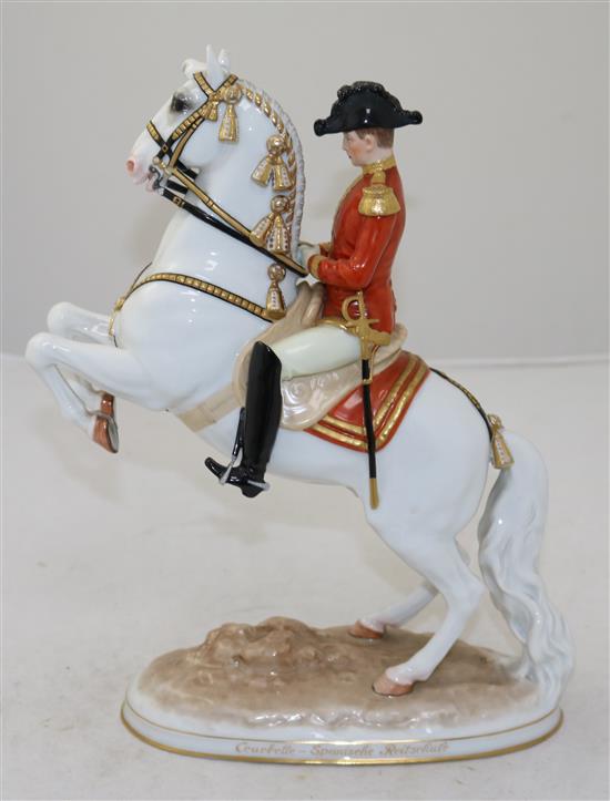 An Augarten Austria Spanish Riding School group, modelled by Dobrich, 28cm, loss to ear